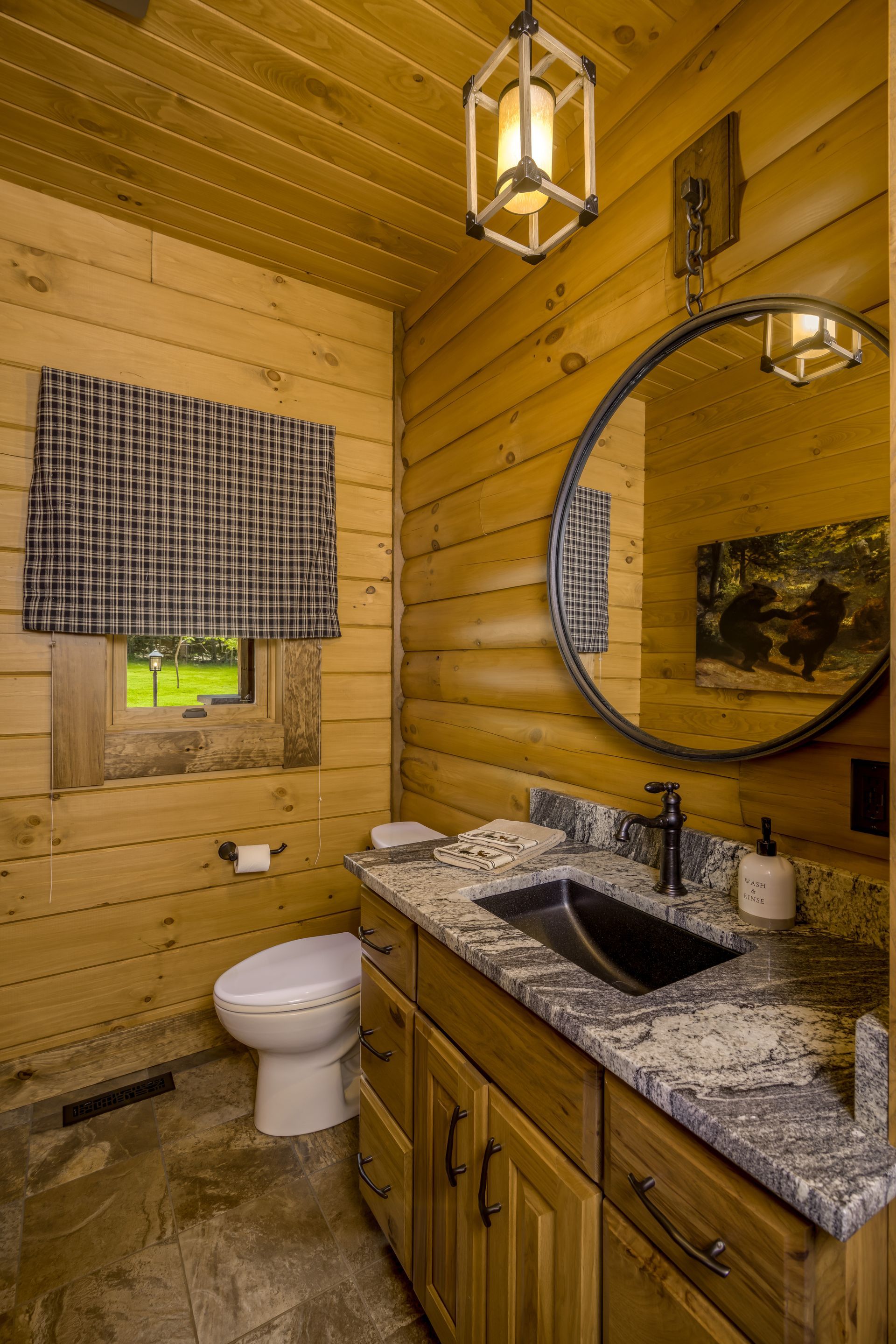 Custom stained hickory bathroom vanity in a log home for a warm look.