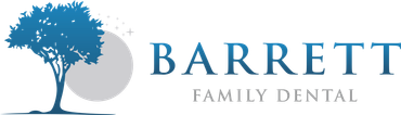 A logo for barrett family dental with a tree in the middle