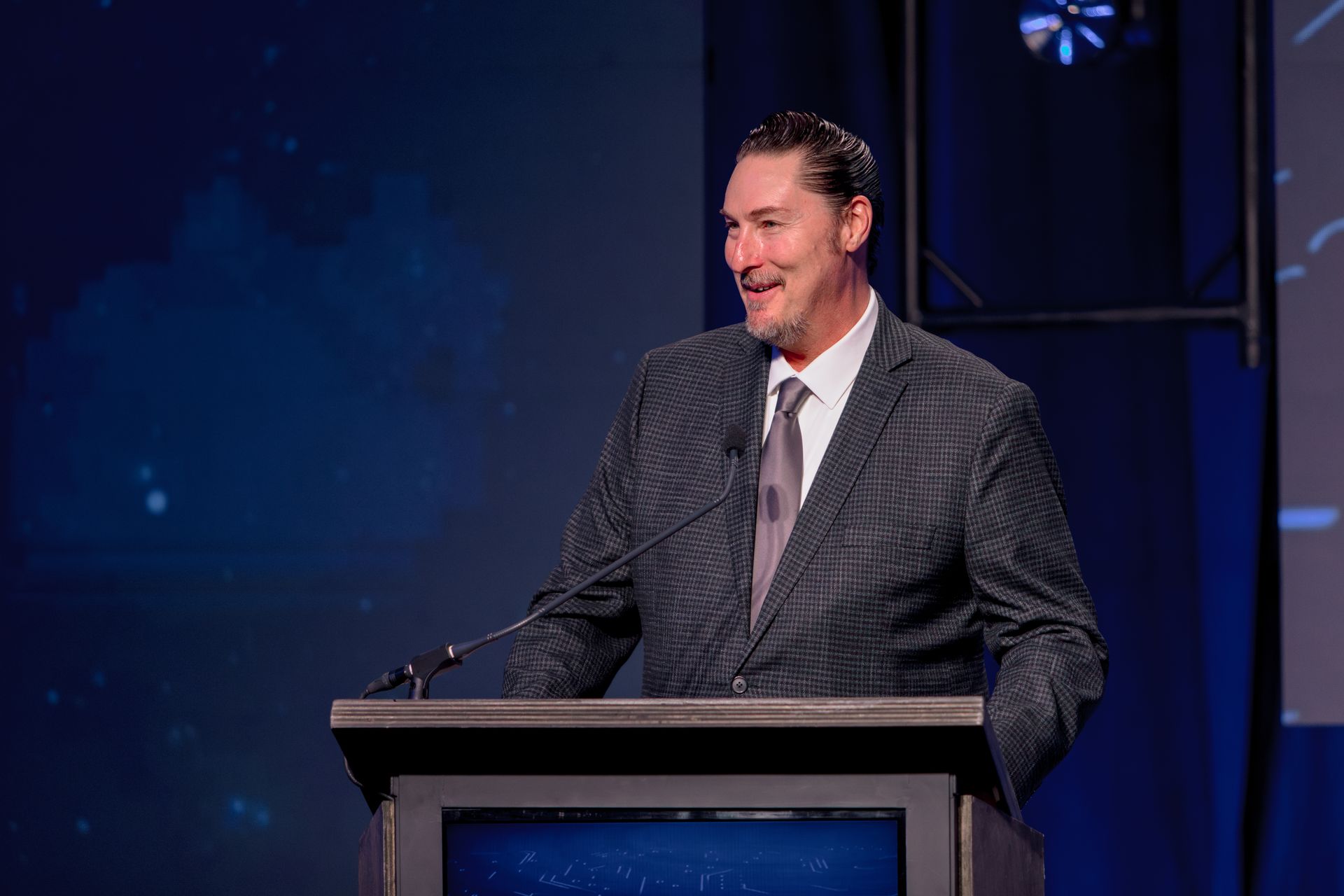 Speaker at the Hall of Fame Gala podium