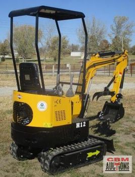 A small yellow excavator with the number h12 on it