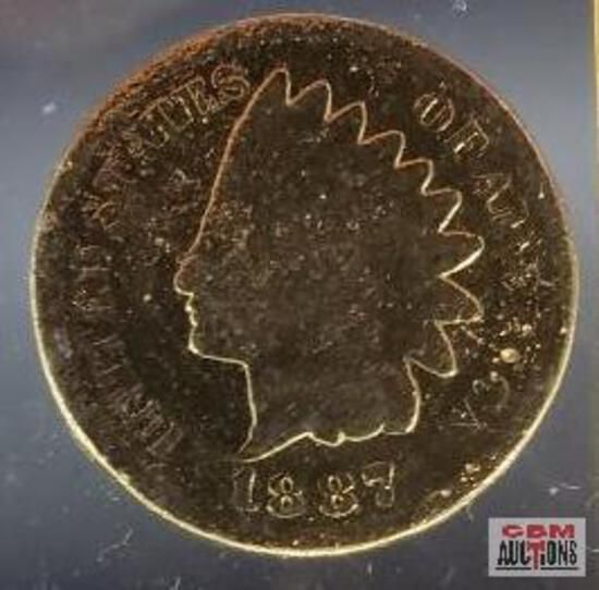 A coin with the year 1887 on it