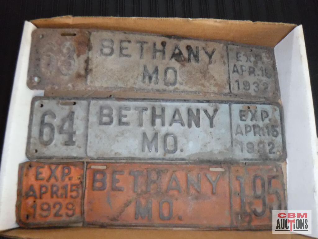 A collection of bethany md license plates in a box