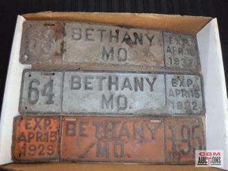 A collection of bethany md license plates in a box