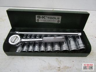 A box of s.k tools with sockets and a ratchet