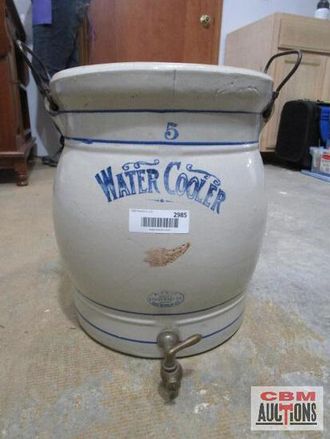 A water cooler with the number 5 on it