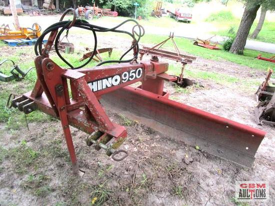 A red rhino950 plow is sitting in the dirt