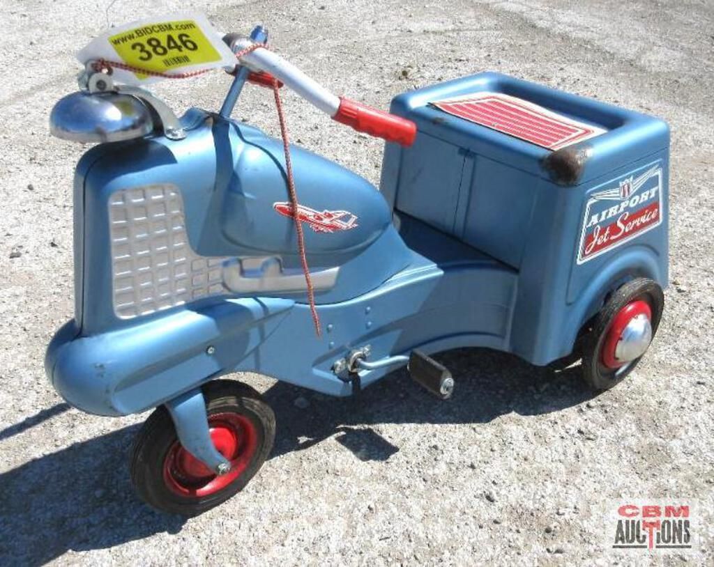 A blue toy tractor has a tag that says 3846 on it