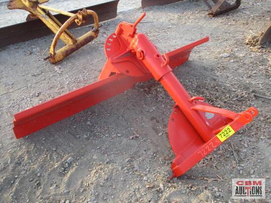 A red tractor blade with a yellow tag on it