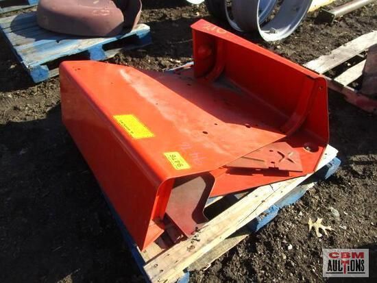 A red piece of metal is sitting on a wooden pallet