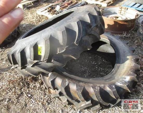 A person is holding a tire that has a yellow tag on it
