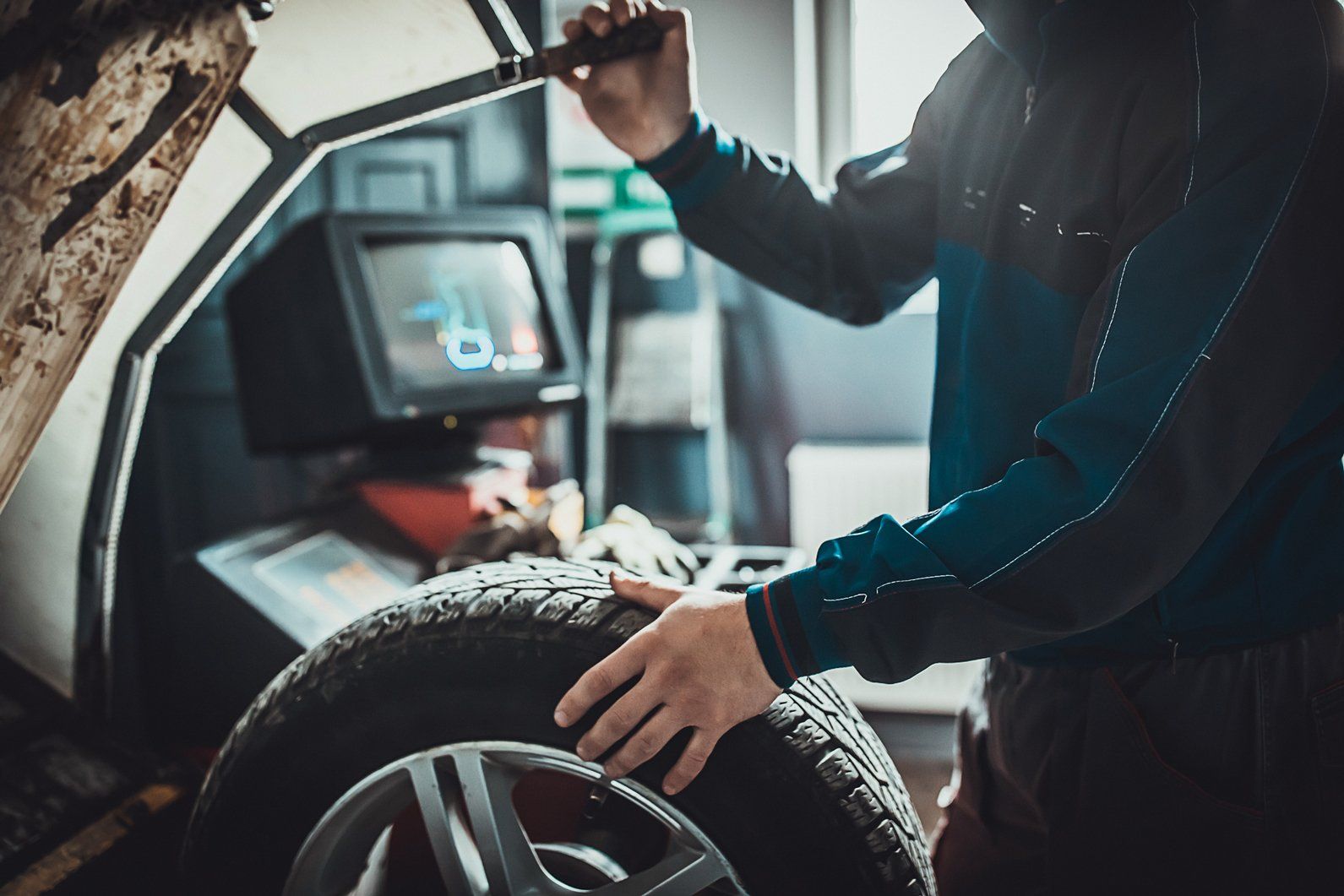 Mechanic Balancing A Tyre — New Lambton, NSW — Greg Stone Tyres