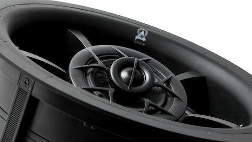 Close-up of a black vehicle wheel with a silver central hub and fan-like spokes.