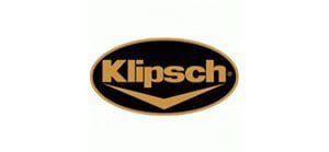 Klipsch logo in gold on a black oval background
