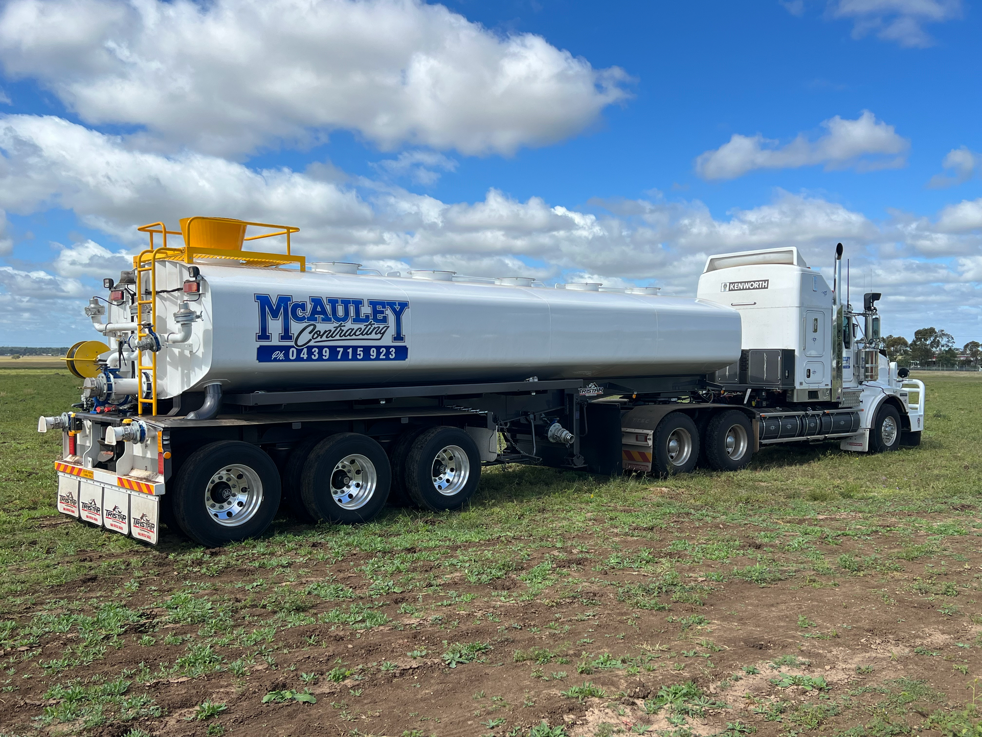 A prime mover towing a water tank