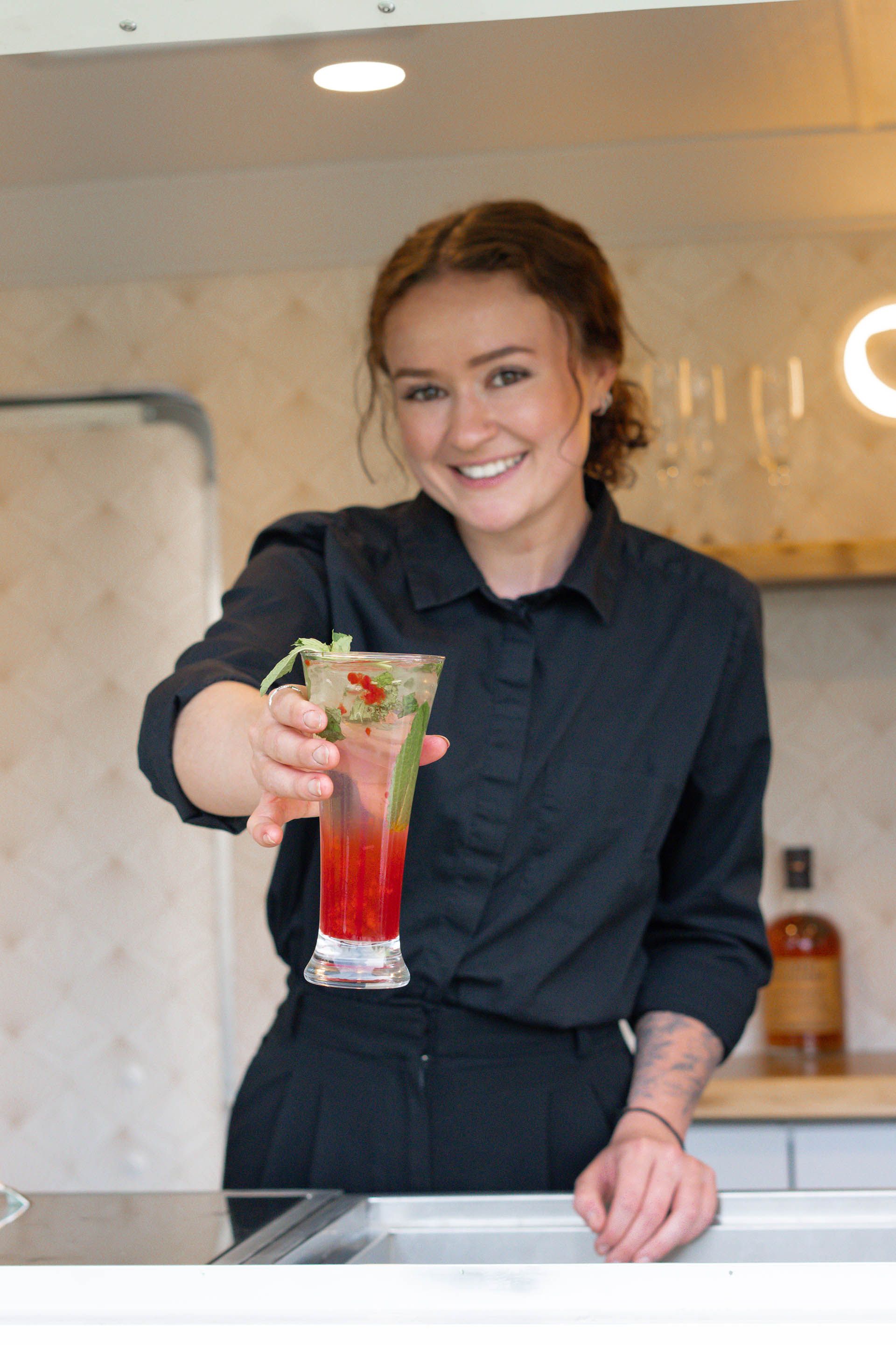 Bartender serving a drink