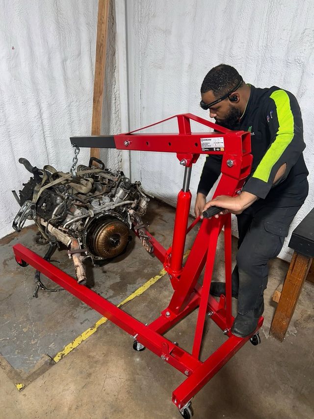 Technician Removing Vehicle Engine With Shop Hoist | L&H Automotive
