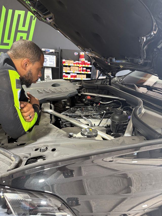 Technician Diagnosing Vehicle With Digital Scan Tool | L&H Automotive