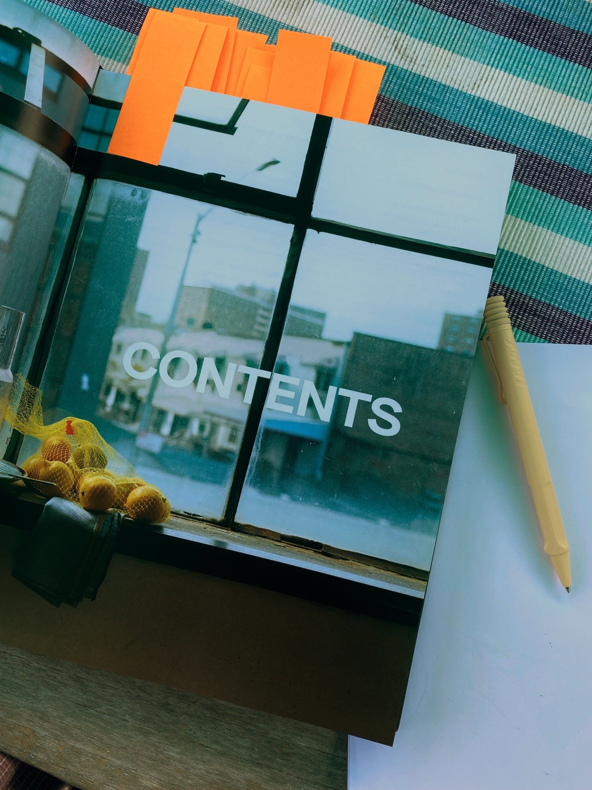 A book is open to a page that says contents