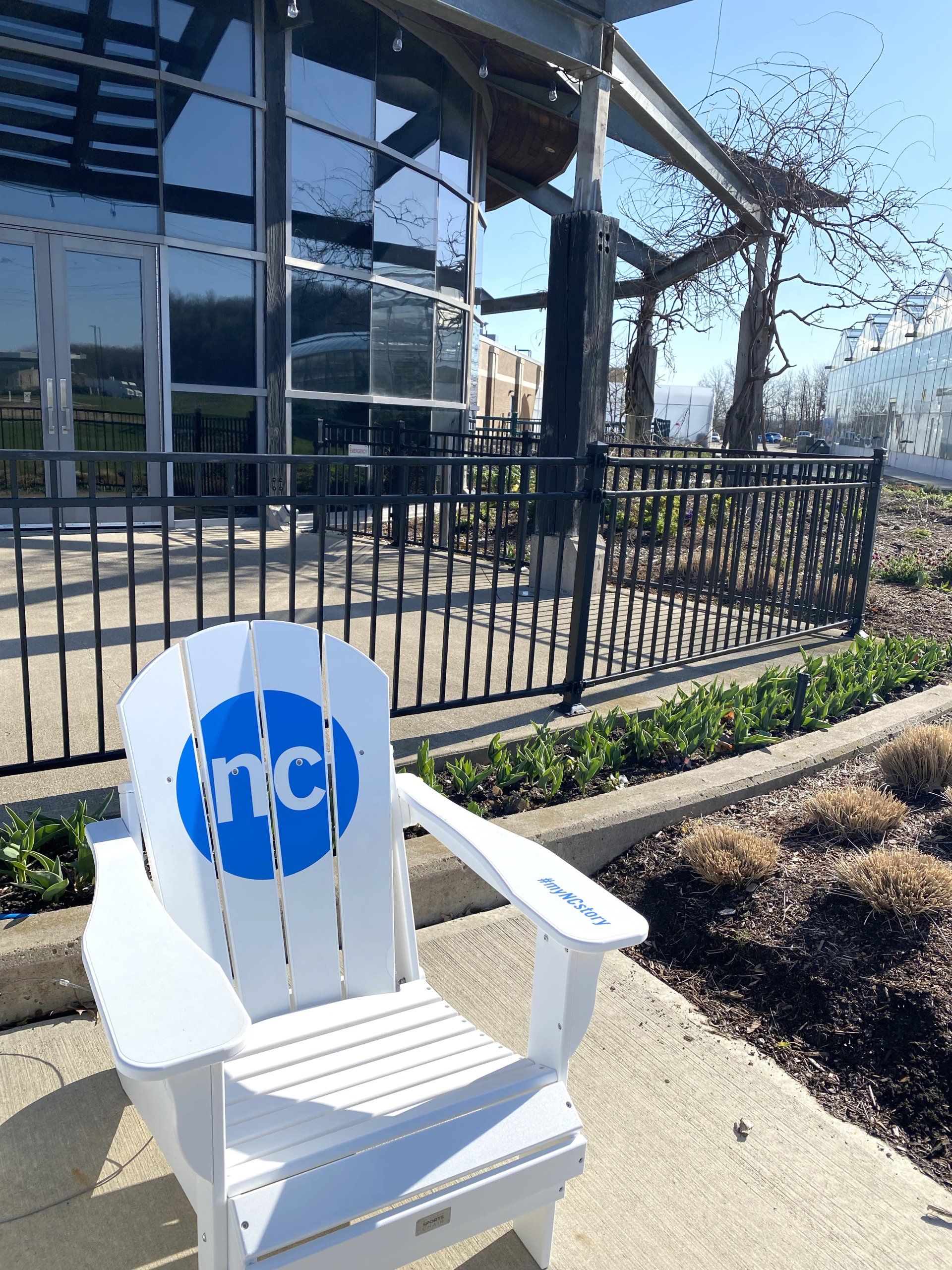 A white chair with the word nc on it