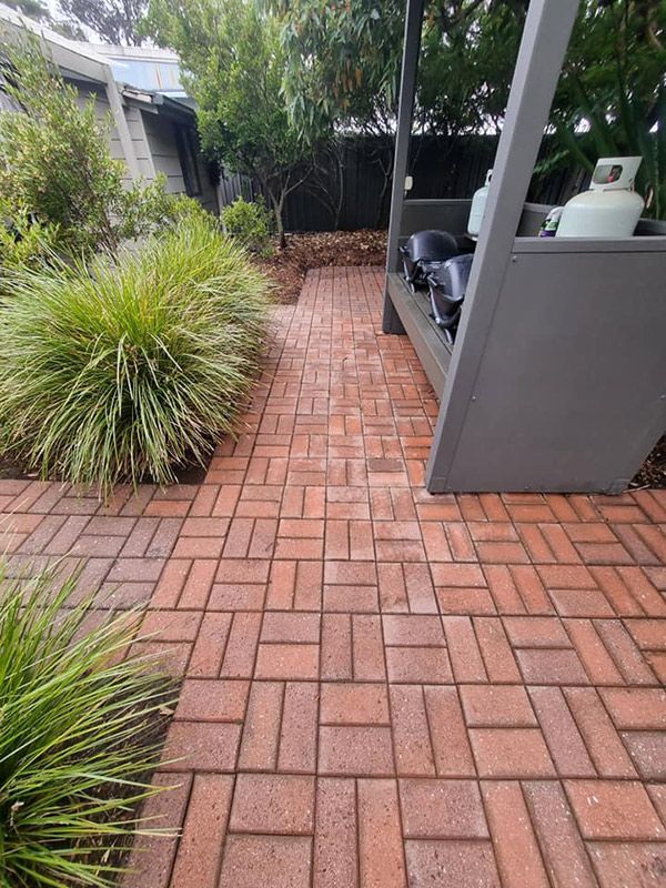 A Newly Cleaned Brick Walkway Leads To A Gazebo — Jervis Bay Pressure Washing & Property Maintenance in Sussex Inlet, NSW