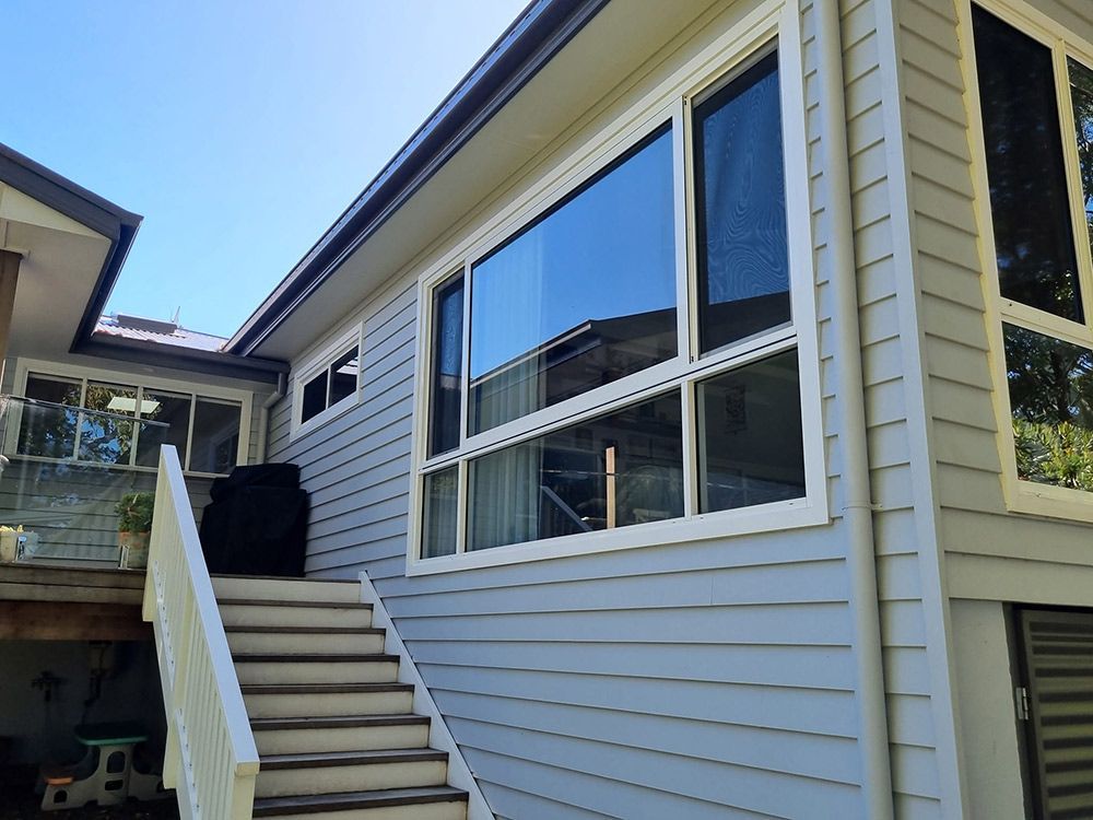 House With Stairs Leading Up To It And A Lot Of Windows — Jervis Bay Pressure Washing & Property Maintenance In Culburra, NSW