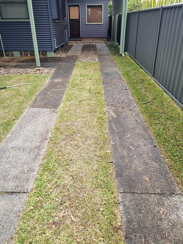 A Concrete Walkway Before Cleaning — Jervis Bay Pressure Washing & Property Maintenance in Jervis Bay, NSW