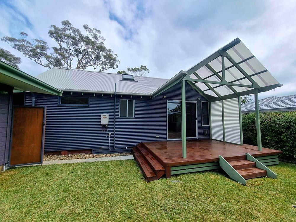 Front Of The House With Wooden Deck Cleaned — Jervis Bay Pressure Washing & Property Maintenance in Sanctuary Point, NSW