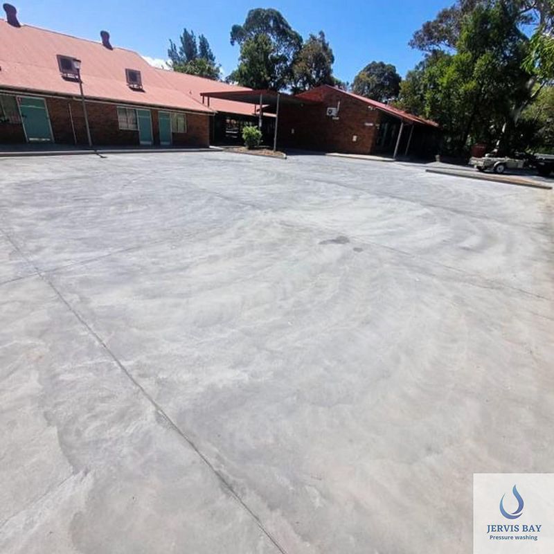 A Concrete Driveway In Front Of A House — Jervis Bay Pressure Washing & Property Maintenance In Berry, NSW