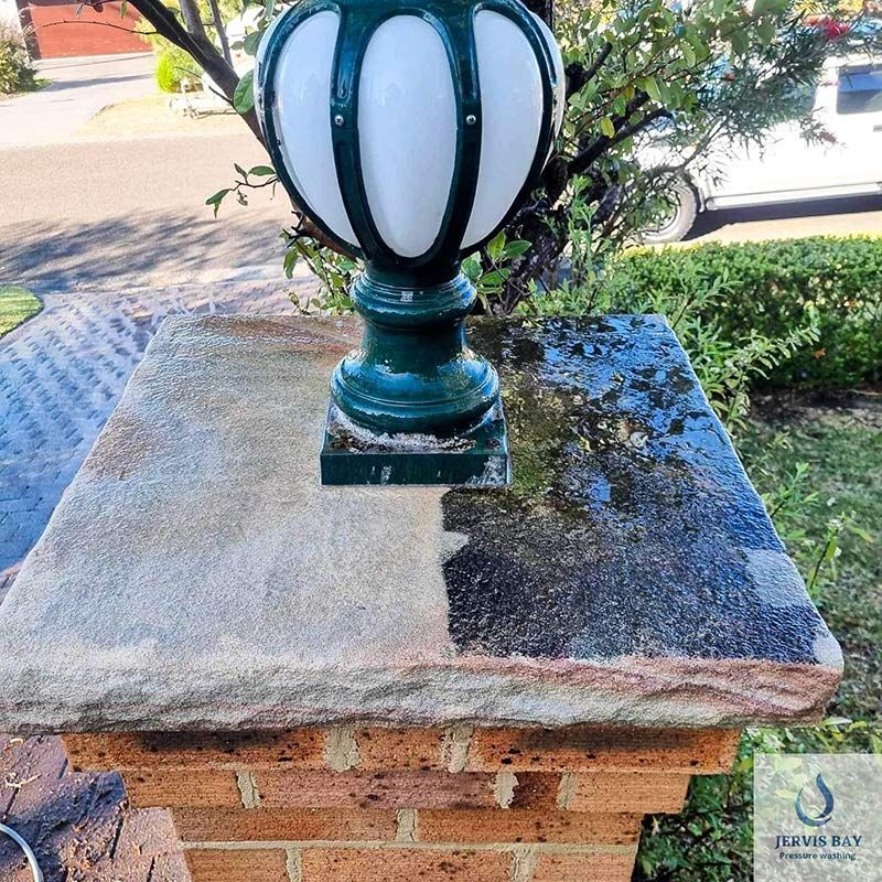 A Lamp Post Is Sitting On Top Of A Brick Pillar — Jervis Bay Pressure Washing & Property Maintenance in Vincentia, NSW