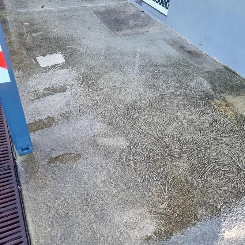 A Dirty Concrete Floor Before Cleaning — Jervis Bay Pressure Washing & Property Maintenance in Culburra, NSW