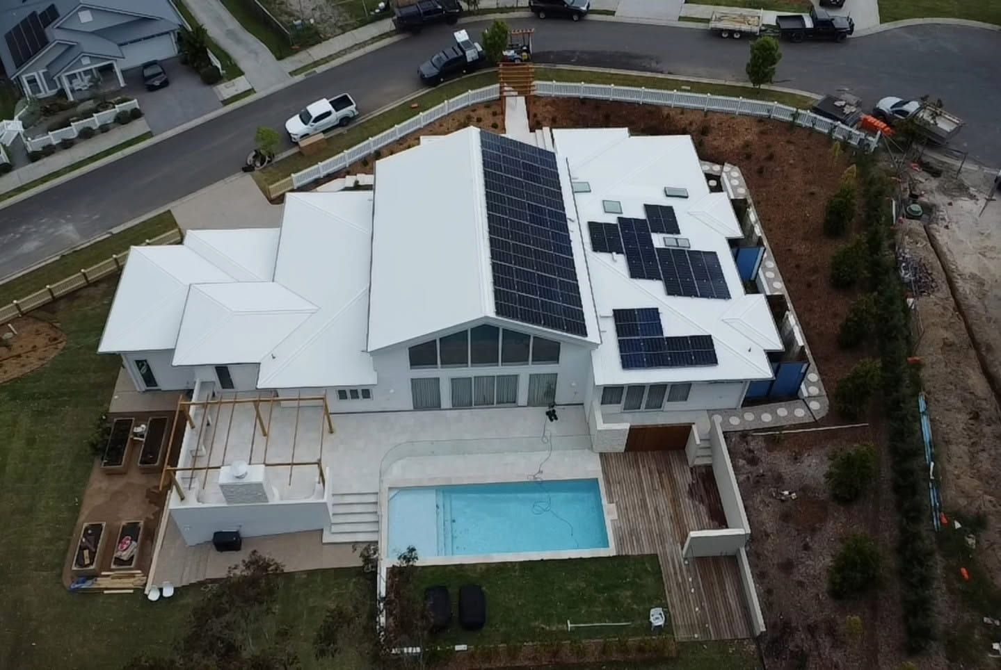 Aerial View of a Modern House With Solar Panels — Jervis Bay Pressure Washing & Property Maintenance in Sanctuary Point, NSW