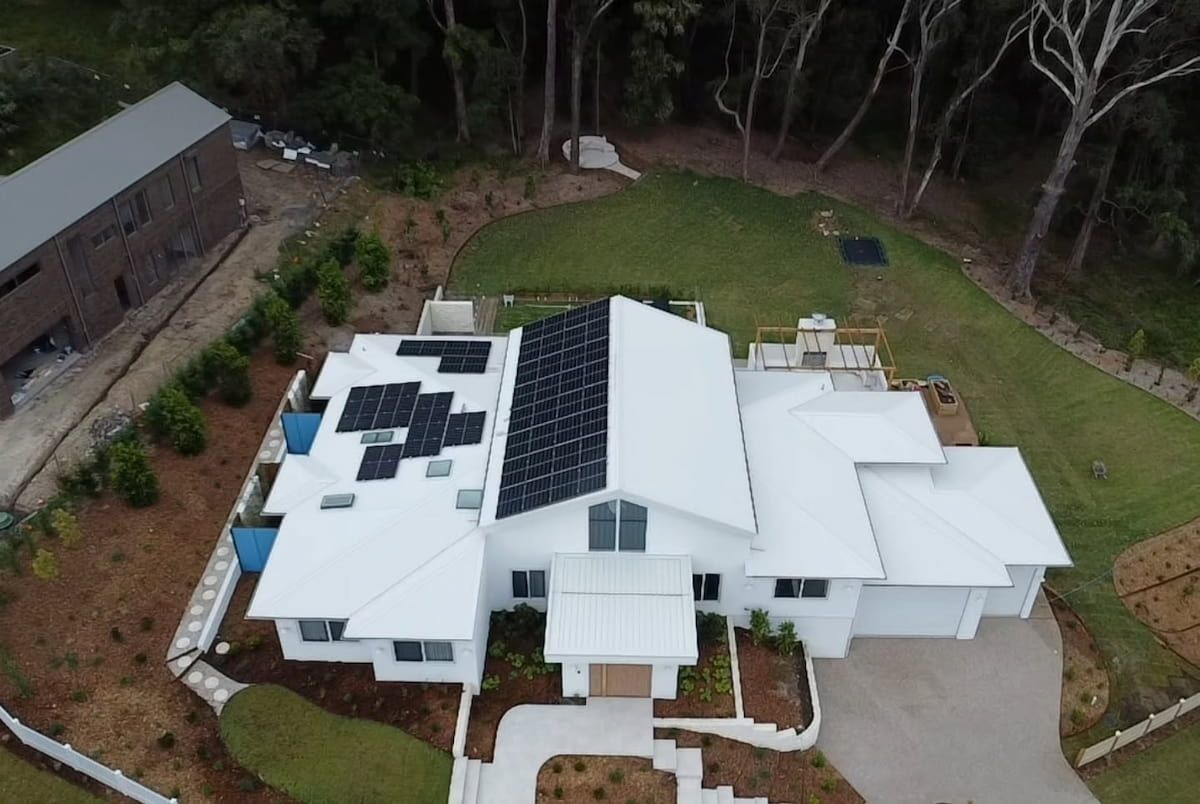 Aerial View of a Modern White House With Solar Panels — Jervis Bay Pressure Washing & Property Maintenance in Vincentia, NSW