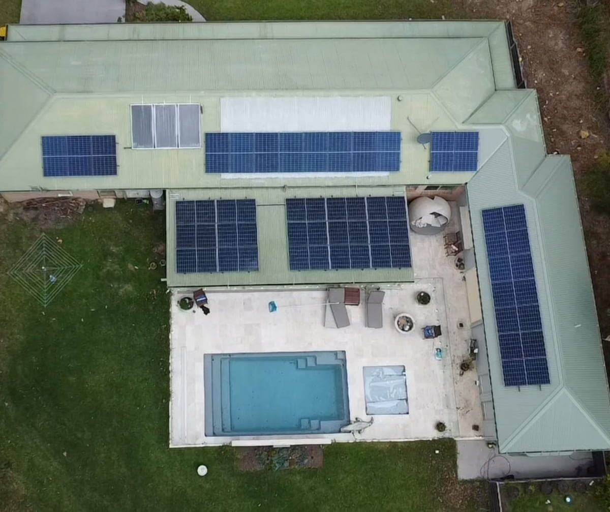 Aerial View of a House With Rooftop Solar Panels — Jervis Bay Pressure Washing & Property Maintenance in Culburra, NSW