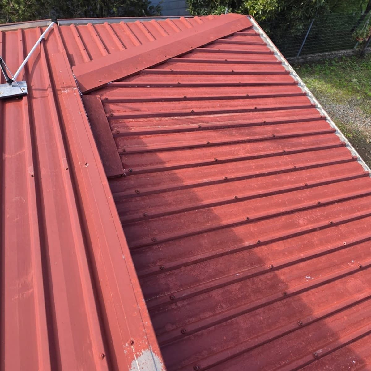 Red Metal Roof — Jervis Bay Pressure Washing & Property Maintenance in Culburra, NSW