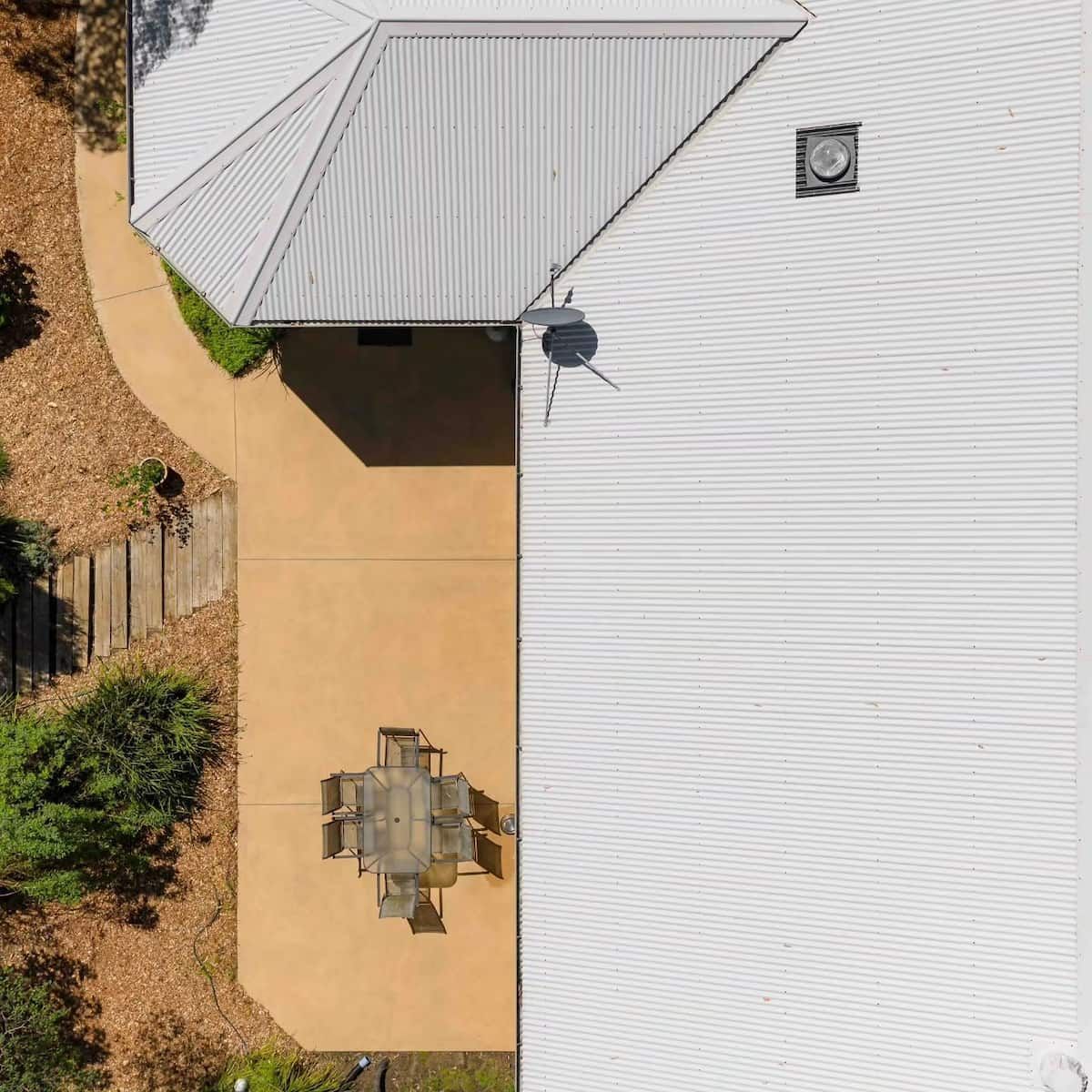 Aerial View of a House Roof Beside a Patio — Jervis Bay Pressure Washing & Property Maintenance in Jervis Bay, NSW