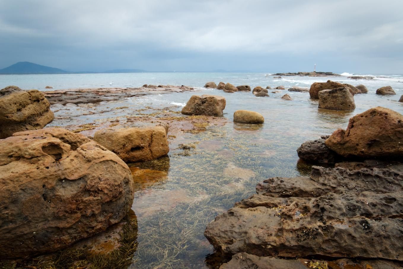 There Are A Lot Of Rocks In The Water On The Beach — Jervis Bay Pressure Washing & Property Maintenance In Culburra, NSW