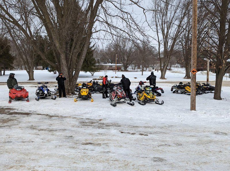 People With Their Snowmobile