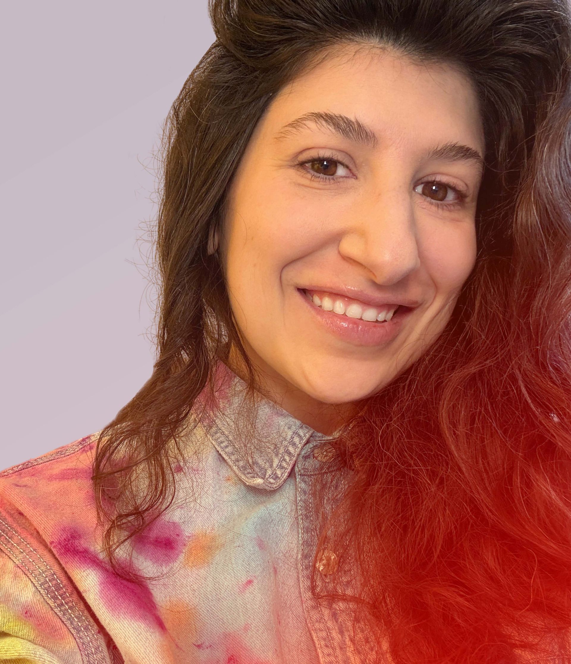 head shot of Cristina against a light purple background
