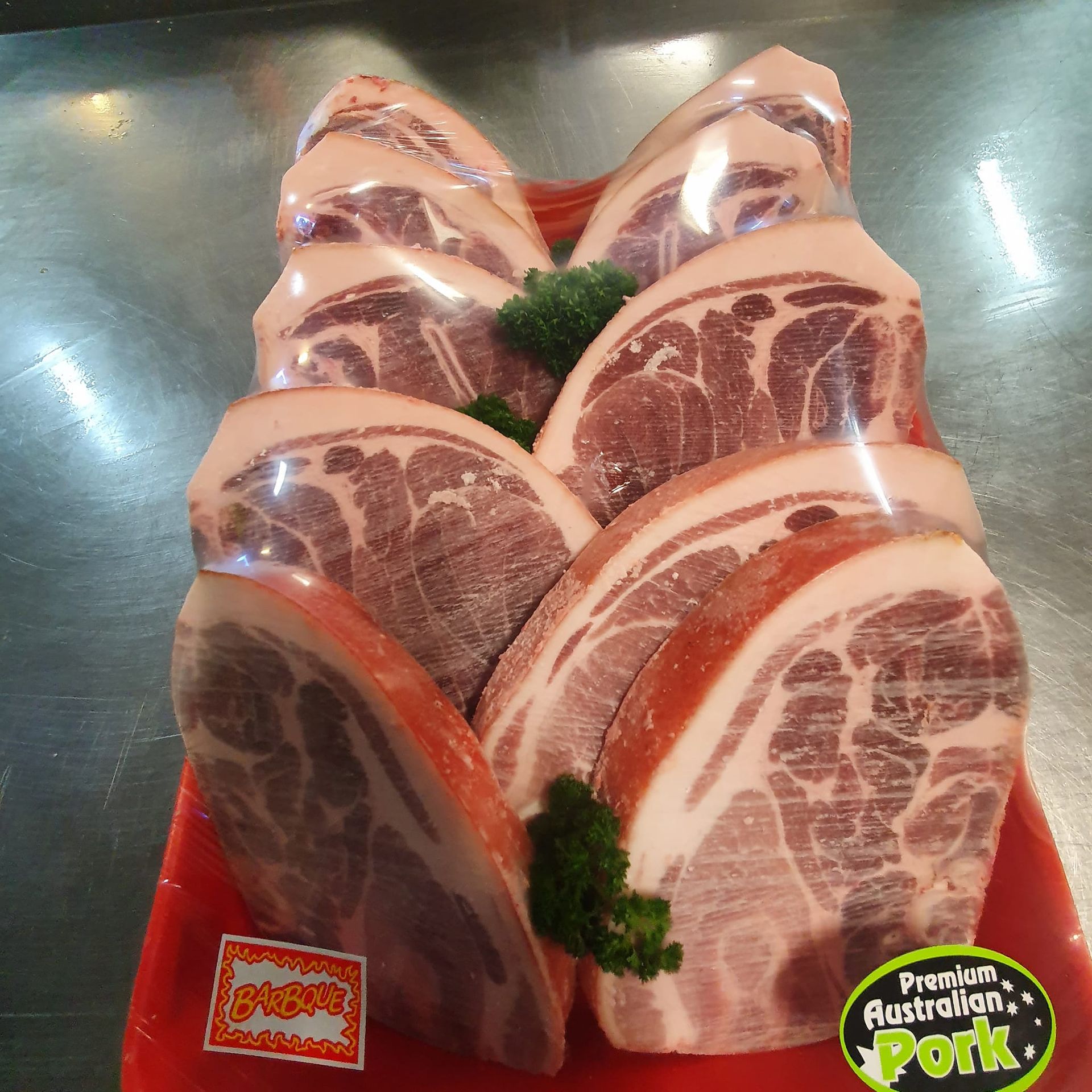 A Packaged Pork Cuts on a Red Tray, Wrapped in Clear Plastic — Paddock to Plate in Tamworth, NSW