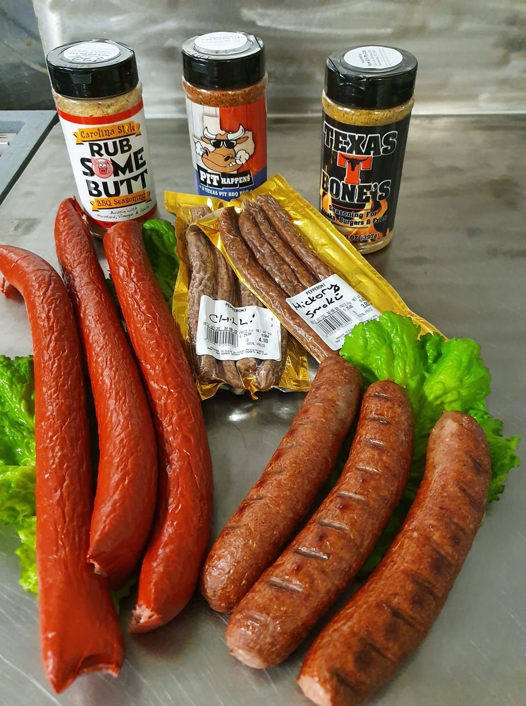 A Sausages and Spice Rubs on a Metal Surface, With Lettuce — Paddock to Plate in Tamworth, NSW