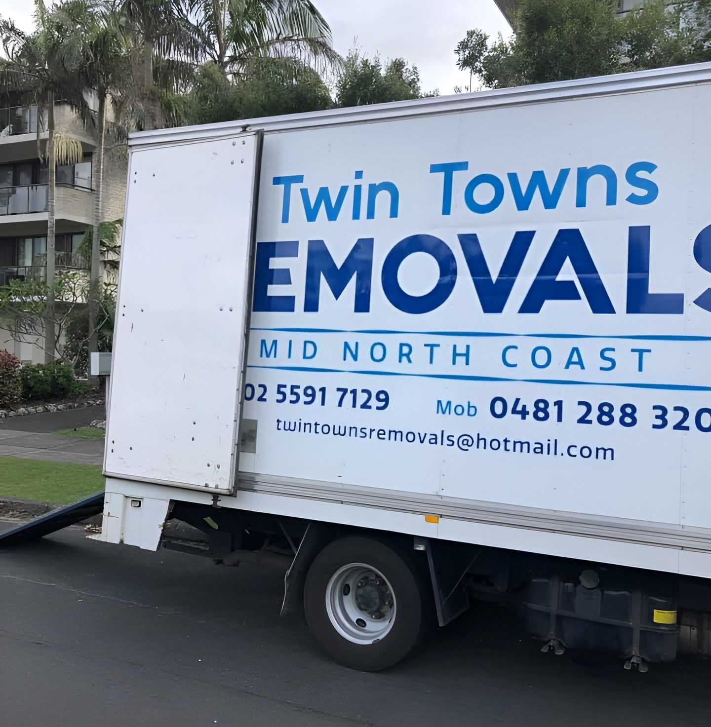 Whtie Twin Towns Removalists Taree truck parked on a street near apartments