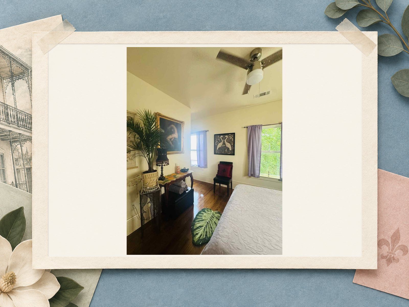 Guest bedroom with local artwork and hardwood floors at The New Marigny House vacation rental in New Orleans