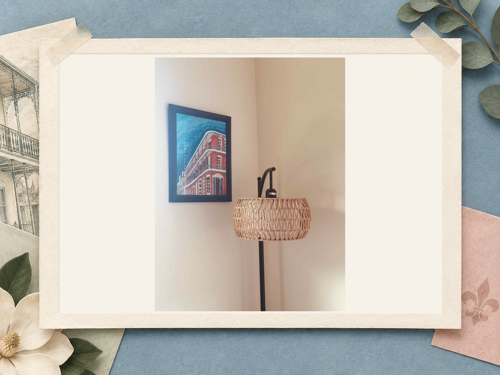 Woven floor lamp beside a New Orleans painting at The New Marigny House vacation rental