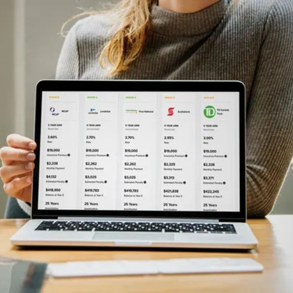 Woman holding a laptop displaying mortgage options from various financial institutions. 