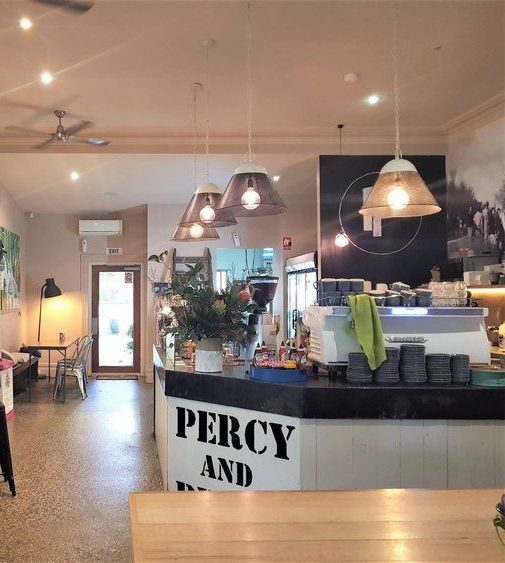 Cafe interior with counter, pendant lights, and 