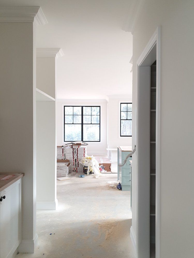 A Hallway Leading To A Living Room In A House Under Construction — Crampton Painting & Decorating Pty Ltd In Maiden Gully, VIC