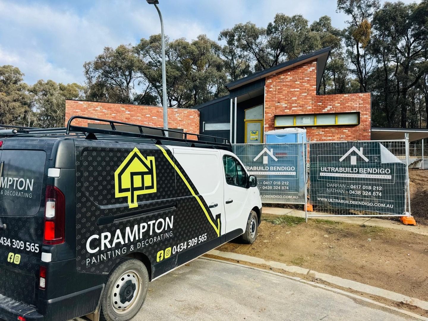 A Person Is Painting A Wooden Surface With A Brush — Crampton Painting & Decorating Pty Ltd In Castlemaine, VIC