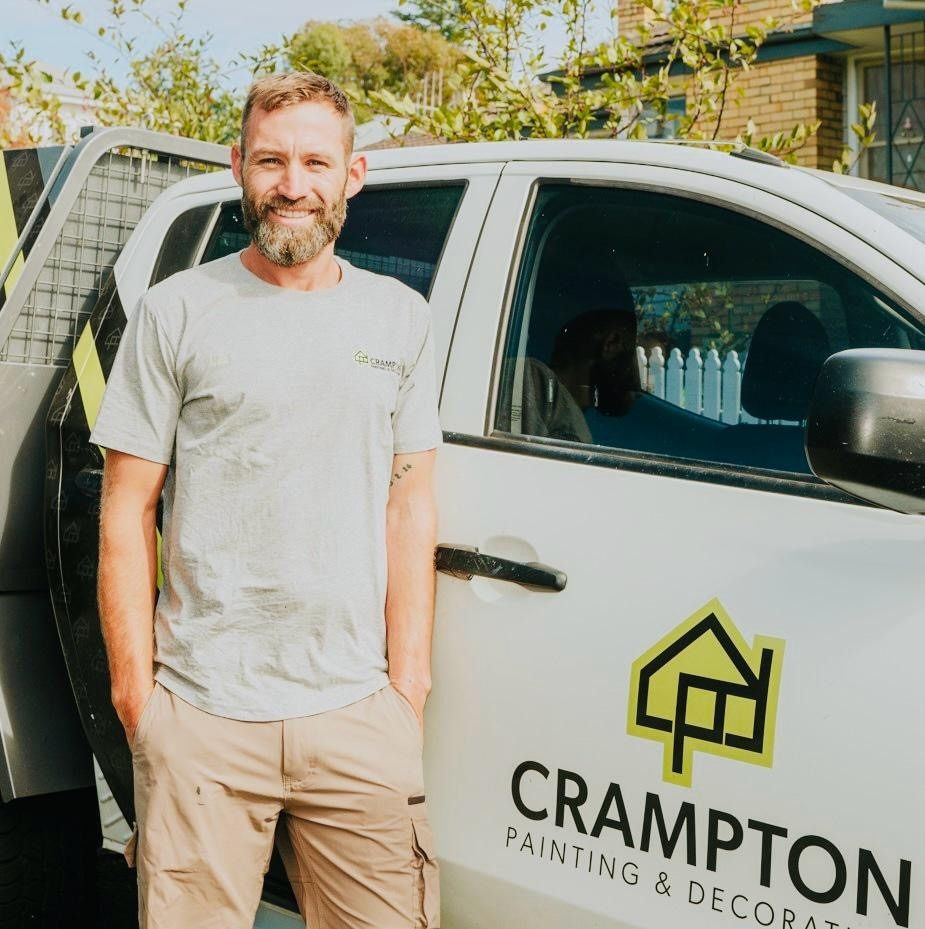 Man standing by a white truck with a logo that says Crampton Painting & Decorating — Crampton Painting & Decorating Pty Ltd In Kyneton, VIC