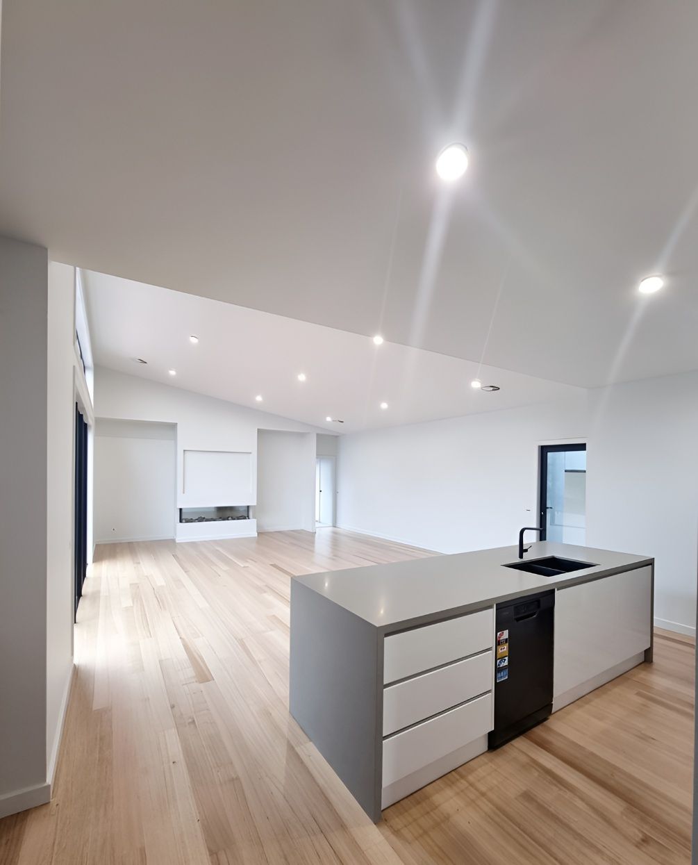 A Kitchen With A Large Island In The Middle Of The Room — Crampton Painting & Decorating Pty Ltd In Maiden Gully, VIC