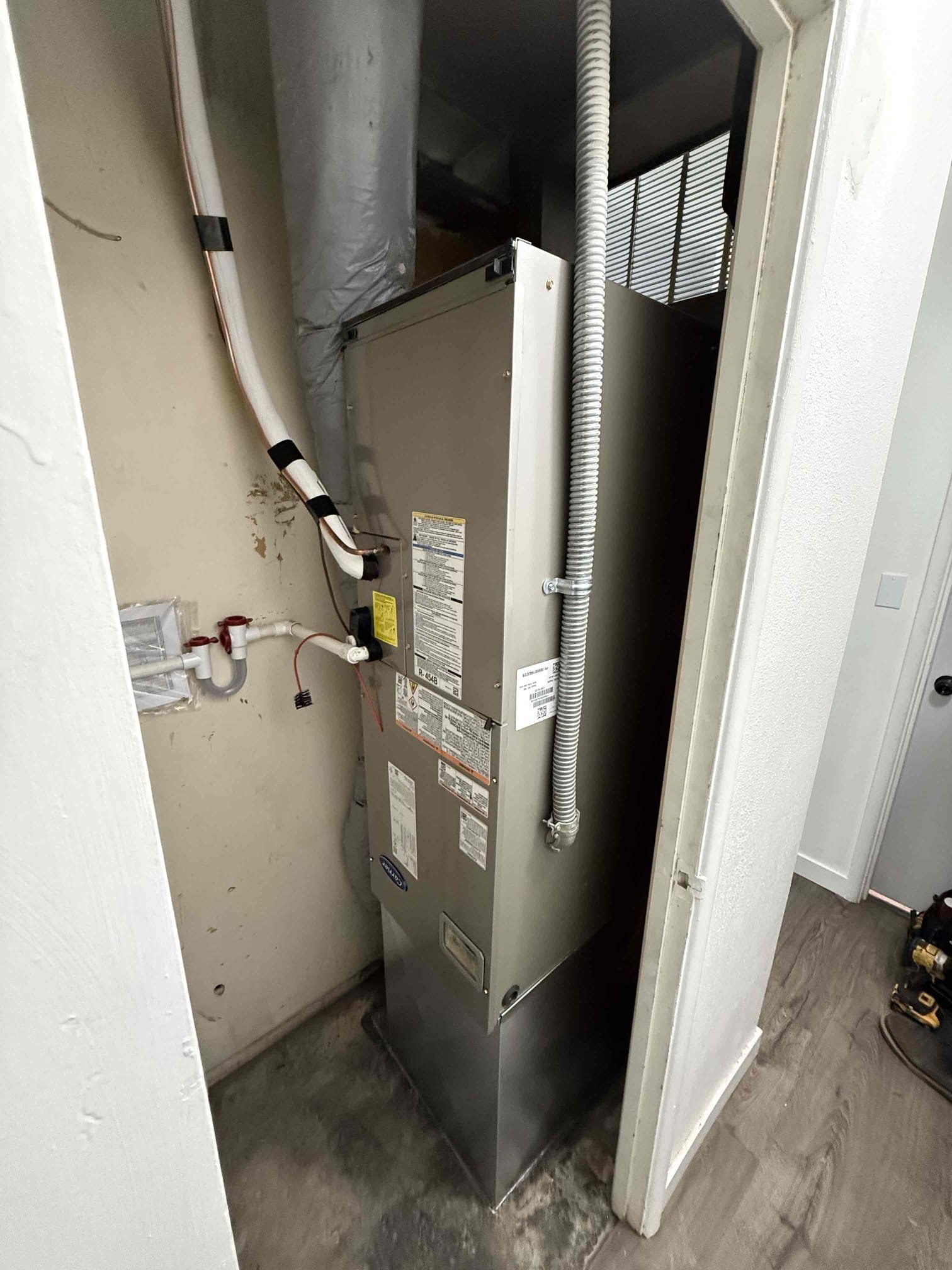 New Carrier air handler installed by Alpine Aire in a closet in a Wenatchee, WA home
